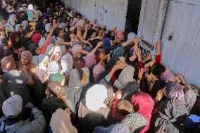 Displaced Palestinians Queue To Buy Bread - Gaza