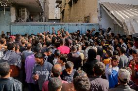 Displaced Palestinians Queue To Buy Bread - Gaza