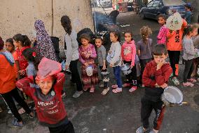 Displaced Children Waiting For Food Distribution - Gaza