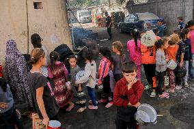 Displaced Children Waiting For Food Distribution - Gaza