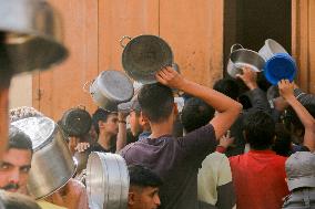 Displaced Children Waiting For Food Distribution - Gaza