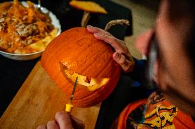 Collecting And Carving Pumpkins For Halloween Night.