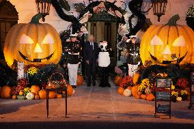 President Biden And First Lady Jill Biden, Dressed As A Panda, Give Out Books And Sweets At The Annual White House Halloween Eve