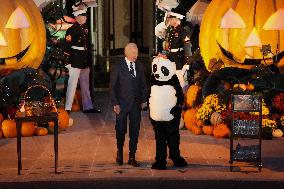 President Biden And First Lady Jill Biden, Dressed As A Panda, Give Out Books And Sweets At The Annual White House Halloween Eve