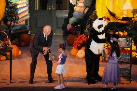 President Biden And First Lady Jill Biden, Dressed As A Panda, Give Out Books And Sweets At The Annual White House Halloween Eve