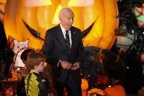 President Biden And First Lady Jill Biden, Dressed As A Panda, Give Out Books And Sweets At The Annual White House Halloween Eve