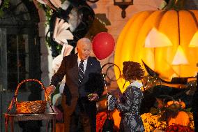 President Biden And First Lady Jill Biden, Dressed As A Panda, Give Out Books And Sweets At The Annual White House Halloween Eve