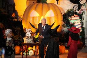 President Biden And First Lady Jill Biden, Dressed As A Panda, Give Out Books And Sweets At The Annual White House Halloween Eve