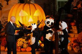 President Biden And First Lady Jill Biden, Dressed As A Panda, Give Out Books And Sweets At The Annual White House Halloween Eve