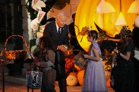 President Biden And First Lady Jill Biden, Dressed As A Panda, Give Out Books And Sweets At The Annual White House Halloween Eve