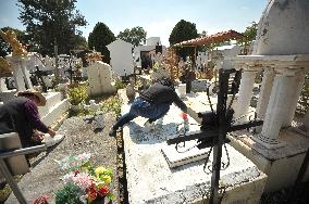 People Visit Cemeteries For The Dia De Muertos Celebrations