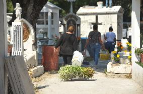 People Visit Cemeteries For The Dia De Muertos Celebrations