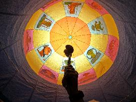 Indian People Enjoy Sight Of Hot Air Balloon Flying During Traditional Diwali Light Balloon Festival