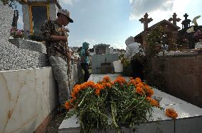 People Visit Cemeteries For Dia De Muertos Celebrations