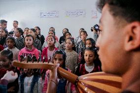 Musicians And Volunteers Perform Classroom - Gaza