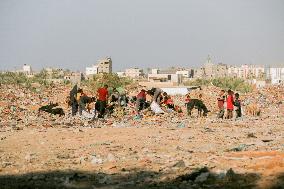 Workers Labor In A Coal-Making Pit - Gaza