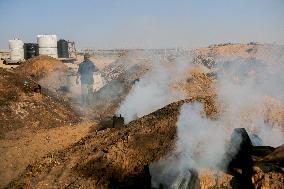 Workers Labor In A Coal-Making Pit - Gaza