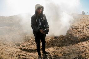 Workers Labor In A Coal-Making Pit - Gaza