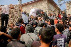 Palestinians Collect Flour - Gaza