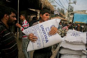 Palestinians Collect Flour - Gaza