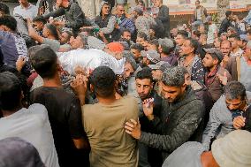 Palestinians Collect Flour - Gaza