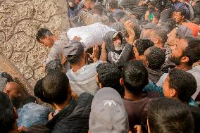 Palestinians Collect Flour - Gaza