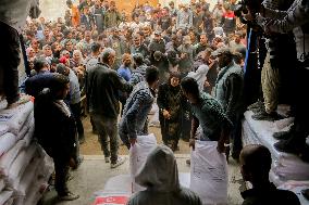 Palestinians Collect Flour - Gaza