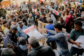 Palestinians Collect Flour - Gaza