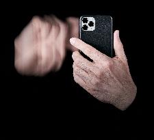 Social Addiction. Hand Swiping On Smartphone Screen With Motion Blur Effect