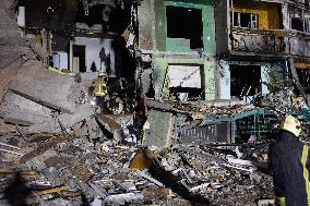 Rescuers Work At The Site Of A Glide Bomb Attack On A Residential Building In Kharkiv