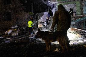 Rescuers Work At The Site Of A Glide Bomb Attack On A Residential Building In Kharkiv