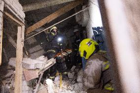 Rescuers Work At The Site Of A Glide Bomb Attack On A Residential Building In Kharkiv