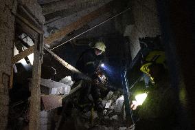 Rescuers Work At The Site Of A Glide Bomb Attack On A Residential Building In Kharkiv