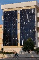 Photovoltaic Facade On Residential Building In Margherita Di Savoia, Italy