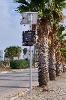 Solar-Powered Speed Bump On Urban Roadside