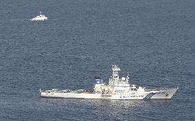 Japan minesweeper sinks after catching fire