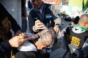 100 Cargo Union Members Shave Heads In Protest To Demand Legislation For Safe Freight Rates