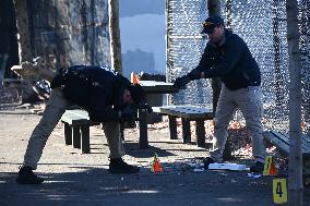 Evidence Markers At Scene Where A 21-year-old Man Was Fatally Stabbed At Steuben Park In Brooklyn New York