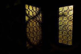 Dimly Lit Interior Of A Catholic Confessional In The Crypt Of Trani Cathedral