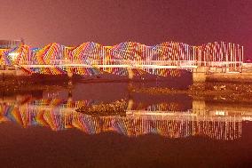 Tourists Play at Rainbow Bridge in Qingdao