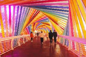 Tourists Play at Rainbow Bridge in Qingdao