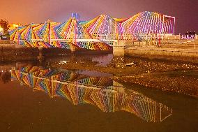 Tourists Play at Rainbow Bridge in Qingdao