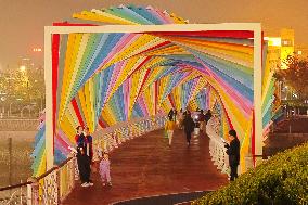 Tourists Play at Rainbow Bridge in Qingdao