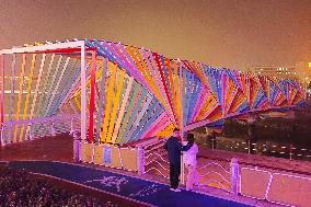 Tourists Play at Rainbow Bridge in Qingdao