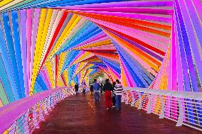 Tourists Play at Rainbow Bridge in Qingdao