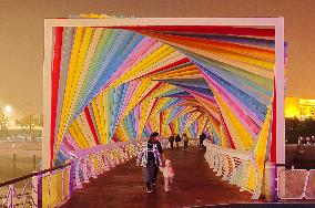 Tourists Play at Rainbow Bridge in Qingdao