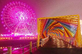 Tourists Play at Rainbow Bridge in Qingdao