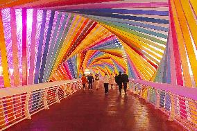 Tourists Play at Rainbow Bridge in Qingdao