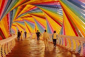 Tourists Play at Rainbow Bridge in Qingdao