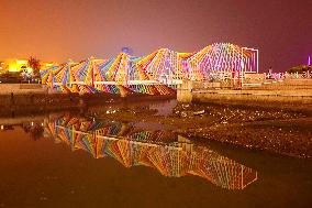 Tourists Play at Rainbow Bridge in Qingdao